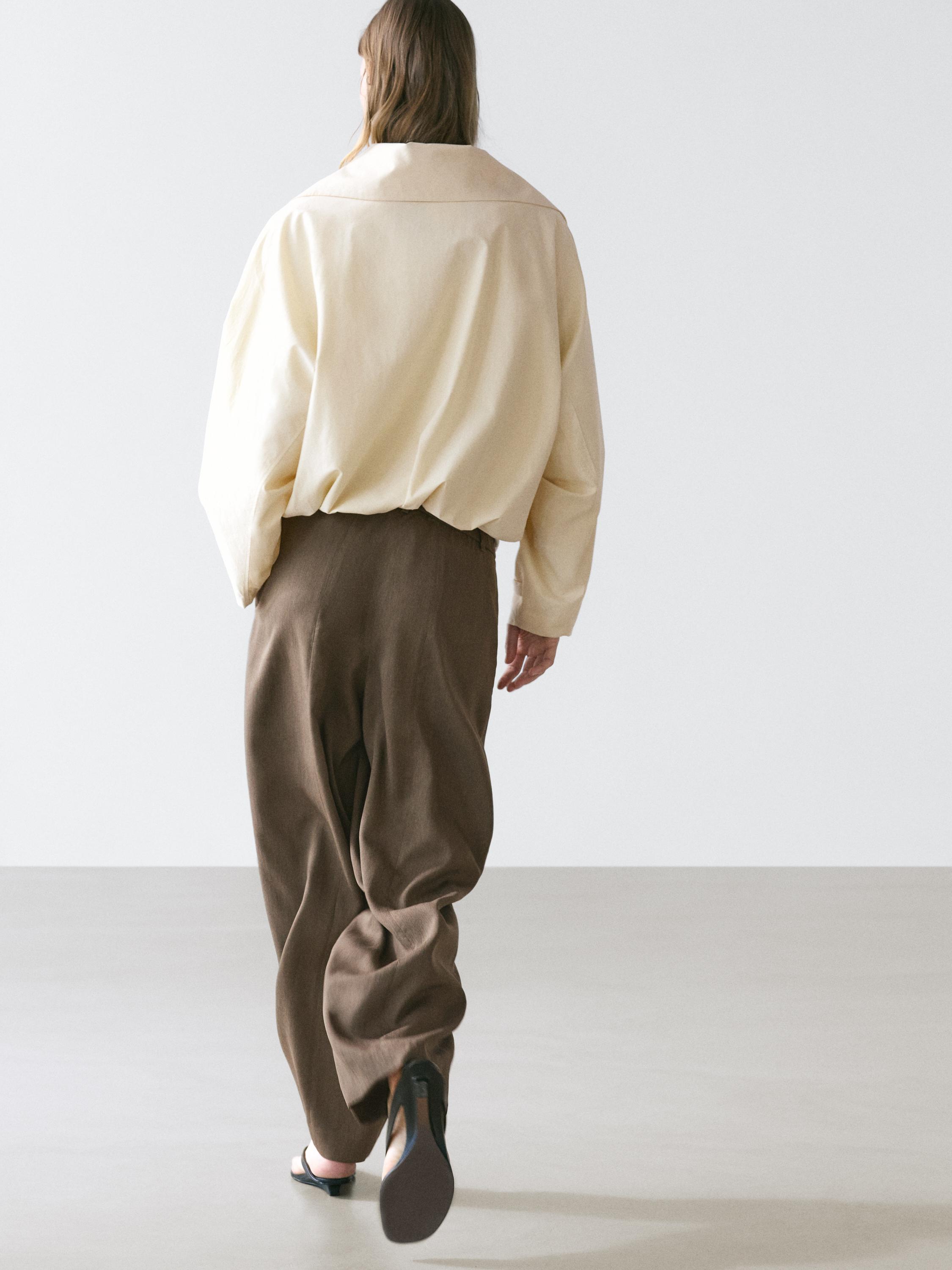 Flowing trousers with elasticated waistband